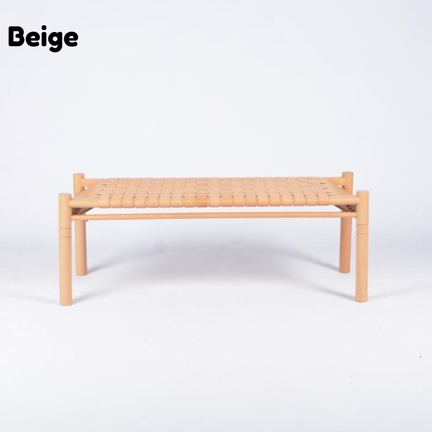 A low rectangular woven chair or bench in beige, featuring a light natural wood frame and a woven seat, shown against a plain white background with the word 'Beige' in the top left corner.