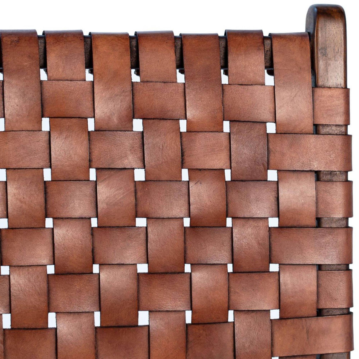 Close-up of a woven brown leather seat with a white background