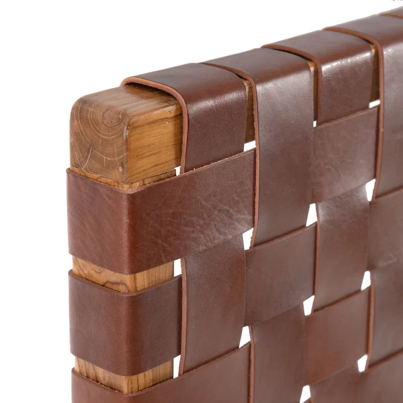 Close-up shot of the leather straps on a Scandinavian Woven King Size Headboard emphasizing the aged leather finish.