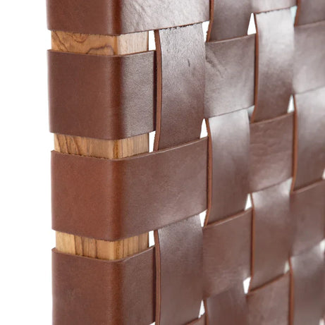 Close-up shot of the leather king headboard.