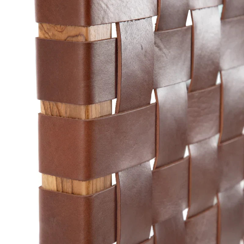 Close-up shot of the leather king headboard.