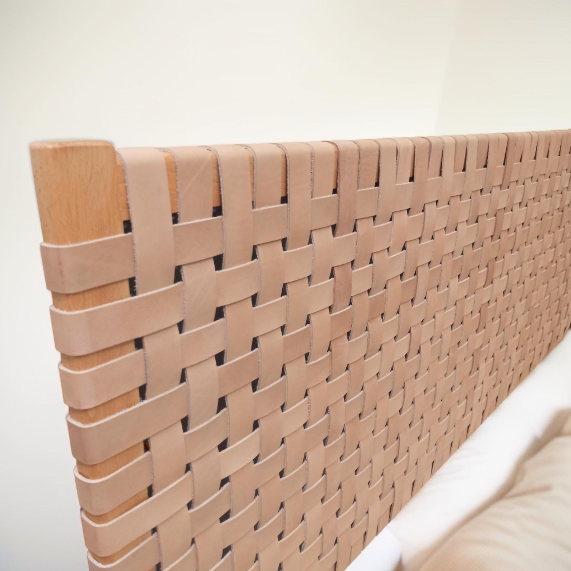 Side profile of a contemporary strap woven leather headboard highlighting its dynamic structure queen size headboard.