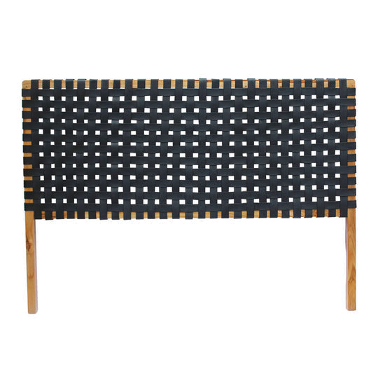 Close-up shot of the leather straps on a classic headboard detailing the fine weaving technique